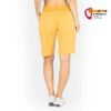 Modell mit oranger Chillaz Mallorca Damen Klettershort von der Rückseite.