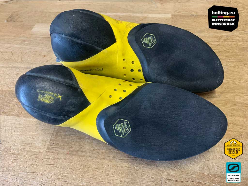 Ein Paar La Sportiva Solution Comp mit neuer Drittelbesohlung.